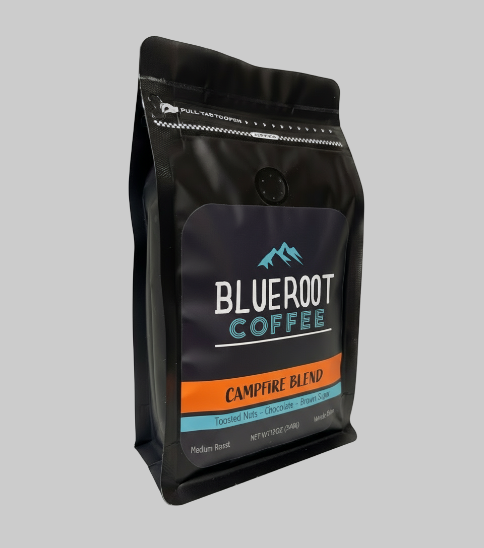 Black coffee bag labeled 'Blueroot Coffee Campfire Blend' on a white background
